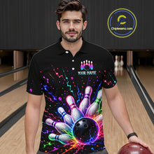 Load image into Gallery viewer, Man wearing a black bowling-themed shirt with colorful design in a bowling alley.