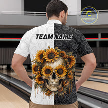 Load image into Gallery viewer, Person wearing a shirt with a skull and sunflower design on a bowling alley.