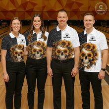 Load image into Gallery viewer, Four people wearing matching shirts with skull and flower designs in a bowling alley.