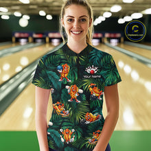 Load image into Gallery viewer, Woman wearing a colorful bowling shirt with cartoon characters in a bowling alley.