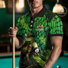 Load image into Gallery viewer, Person wearing a green and black patterned shirt with a crocodile graphic, holding a pool cue and 8-ball on a pool table.