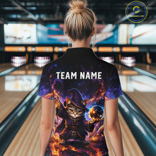 Load image into Gallery viewer, Person wearing a colorful shirt with a cat wizard design in a bowling alley.