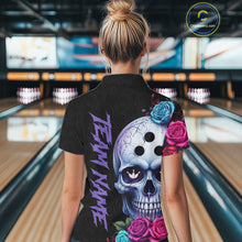 Load image into Gallery viewer, Person wearing a black bowling shirt with a colorful skull design in a bowling alley.