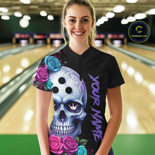 Load image into Gallery viewer, Woman wearing a black bowling jersey with a colorful skull design in a bowling alley.