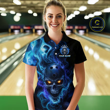 Load image into Gallery viewer, Woman wearing a black bowling polo shirt featuring a flaming skull with glowing orange eyes, blue smoke effects, and custom “YOUR NAME” text.