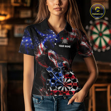 Load image into Gallery viewer, Person wearing a black darts polo featuring patriotic American flag smoke graphics, dartboards, blue darts, and custom team and player name text.