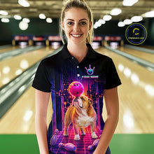 Load image into Gallery viewer, Women’s retro Bulldog neon synthwave bowling polo shirt, front view on female model in bowling lane 