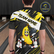 Load image into Gallery viewer, Man wearing a bowling-themed shirt with a cartoon banana character in a bowling alley.