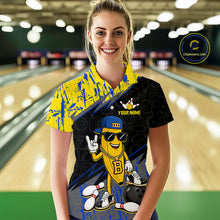 Load image into Gallery viewer, Women polo wearing a colorful bowling shirt with a cartoon character in a bowling alley.