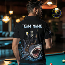 Load image into Gallery viewer, Man wearing a black t-shirt with a graphic design of a skeleton on a shark, with 'TEAM NAME' text, in an indoor setting.