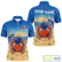 Load image into Gallery viewer, Blue polo shirt with a crab design on a beach, customizable text, and Chiptee Amz branding.