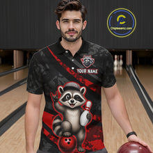 Load image into Gallery viewer, Man wearing a black and red bowling-themed shirt with a raccoon graphic on a bowling alley.