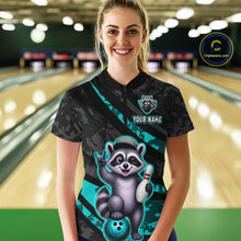 Load image into Gallery viewer, Person wearing a black bowling shirt with a raccoon design in a bowling alley.
