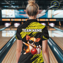 Load image into Gallery viewer, Person wearing a bowling shirt with a dog graphic and 'TEAM NAME' text in a bowling alley.