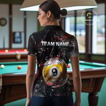Load image into Gallery viewer, Woman wearing a black collared polo shirt with shattered glass graphics, red accent streaks, a custom name area, and a large cracked 9-ball illustration across the lower back.