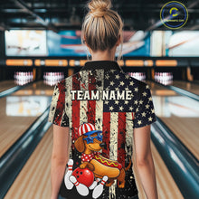 Load image into Gallery viewer, Person wearing a shirt with a dachshund and American flag design in a bowling alley.
