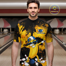Load image into Gallery viewer, Man wearing a black and yellow bowling quarter zip featuring a cool banana mascot dabbing, bowling pins, a blue bowling ball, and custom your name text.