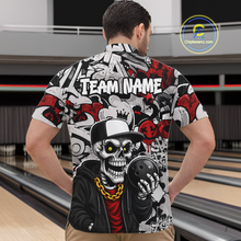 Load image into Gallery viewer, Man wearing a bowling-themed shirt with a skeleton holding a bowling ball in a bowling alley.