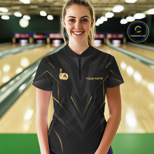Load image into Gallery viewer, Woman wearing a black bowling shirt with gold accents in a bowling alley.