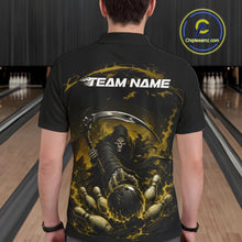 Load image into Gallery viewer, Back view of a male model wearing a black and yellow bowling polo shirt featuring a grim reaper reaching through swirling flames to command a blazing bowling ball crashing into scattered pins in a bowling lane.
