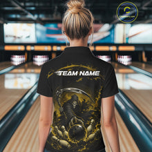 Load image into Gallery viewer, Back view of a female model wearing a black and yellow bowling polo shirt featuring a grim reaper commanding a blazing bowling ball crashing into scattered pins through swirling flames in a bowling lane.