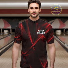 Load image into Gallery viewer, Man wearing a black and red bowling shirt with a logo and text in a bowling alley.