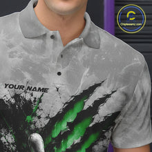 Load image into Gallery viewer, Close-up of the left chest on a gray bowling polo shirt featuring a dramatic green bowling ball and pins graphic with claw-mark artwork.