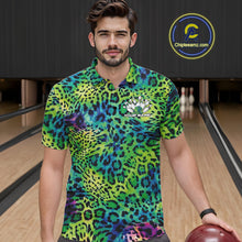 Load image into Gallery viewer, A man stands in a bowling alley wearing a yellow, brown, and black leopard-print bowling shirt with a bowling pin graphic and “Your Name” on the chest.