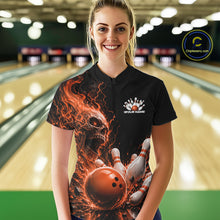 Load image into Gallery viewer, Front view of a female model in a bowling alley wearing a black bowling quarter zip shirt featuring an orange fiery skull with lightning striking a bowling ball and pins and a custom name.

