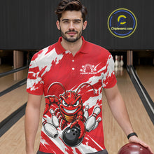 Load image into Gallery viewer, Front view of a male model in a bowling alley wearing a red custom bowling polo shirt with a fierce yet funny crawfish bowling character and a distressed background design.