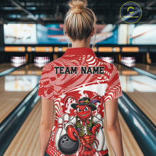 Load image into Gallery viewer, Back view of a female model in a bowling alley wearing a red custom bowling polo shirt with a funny Cajun crawfish leaning on a bowling ball and a swamp-inspired texture background.