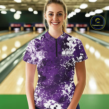 Load image into Gallery viewer, Woman wearing a purple and white bowling shirt with splatter design in a bowling alley.