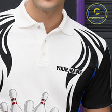 Load image into Gallery viewer, Close-up of the left chest on a white, black, and blue bowling polo shirt featuring bowling ball and pins graphics.