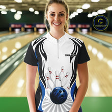 Load image into Gallery viewer, Female model wearing a white, black, and blue bowling quarter zip shirt featuring bowling ball and pins graphics, shown from the front at a bowling lane.