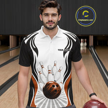 Load image into Gallery viewer, Front view of a male model wearing a white, black, and orange bowling polo shirt with bowling ball hitting the pins artwork at a bowling lane.