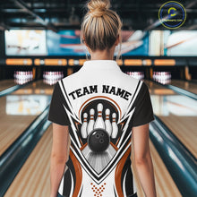 Load image into Gallery viewer, Back view of a female model inside a bowling center wearing a white, black, and orange bowling polo shirt featuring bowling ball striking pins graphics.