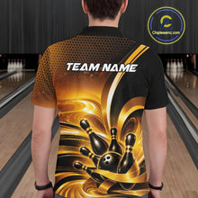 Load image into Gallery viewer, Back view of a male model in a bowling venue wearing a bowling polo shirt featuring glossy gold and black bowling ball and pins graphics.