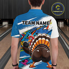 Load image into Gallery viewer, Back view of a male model wearing a blue custom bowling polo shirt featuring a funny graffiti style turkey holding a bowling ball, paint splatter details, and a custom name in a bowling alley.