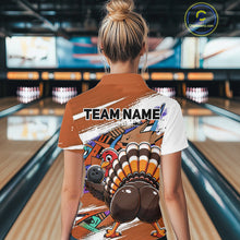 Load image into Gallery viewer, Back view of a female model in a bowling alley wearing an orange custom quarter zip bowling shirt with a funny graffiti turkey holding a bowling ball, paint splatter accents, and a personalized name.