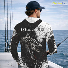 Load image into Gallery viewer, Man on a boat wearing a black and white long-sleeve shirt with 'Skeleton Fish' design, looking out at the ocean.