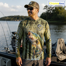 Load image into Gallery viewer, Man wearing a fishing-themed shirt with a large bass graphic on a boat by a lake.