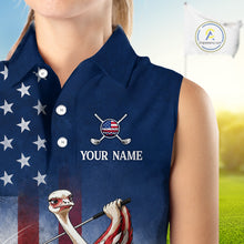Load image into Gallery viewer, Navy blue sleeveless golf shirt with American flag design and customizable text on a blurred golf course background.