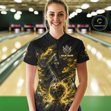 Load image into Gallery viewer, Woman wearing a black and yellow shirt with a design of a skeleton holding a bowling ball in a bowling alley.
