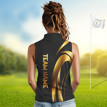 Load image into Gallery viewer, Woman wearing a Black and Gold womens  sleeveless golf polo shirt and 'Team Name' text on the back, standing on a golf course.