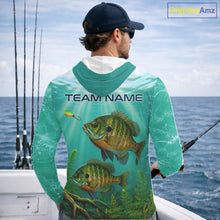Load image into Gallery viewer, Angler wearing Custom Bluegill Fishing Jersey long sleeve hooded tournament fishing shirt with personalized name on the sleeve.