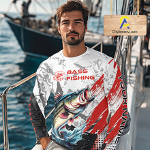 Load image into Gallery viewer, A fisher man wearing a bass fishing shirt long sleeve with personalized name, sitting on a boat