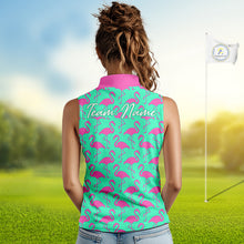 Load image into Gallery viewer, Woman wearing a green sleeveless polo shirt with pink flamingo pattern and 'Team Name' text on the back, standing on a golf course.