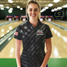 Load image into Gallery viewer, Woman wearing a black American flag wings bowling polo shirt at a bowling alley front view.