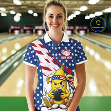 Load image into Gallery viewer, Woman wearing a patriotic-themed polo shirt with a banana cartoon character holding a bowling ball in a bowling alley.