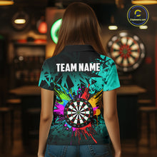 Load image into Gallery viewer, Back view of woman wearing a turquoise colorful darts jersey inside a darts hall.